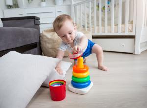 Infant developing movement skills of reaching and crawling