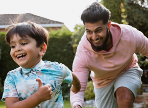 adult playing with child