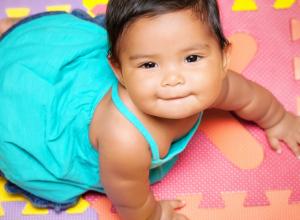 Baby on colored mats
