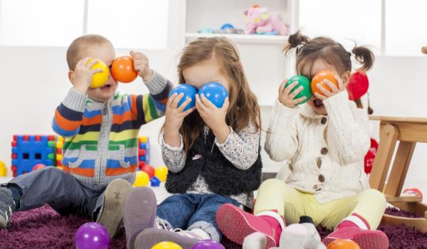 Toddlers in EY setting with colored balls