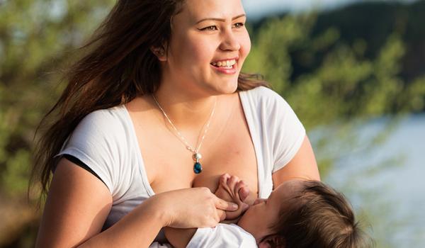 Woman breastfeeding a toddler