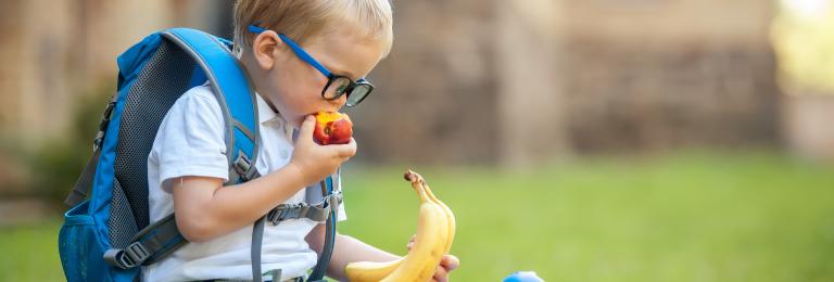 Child eating apple.