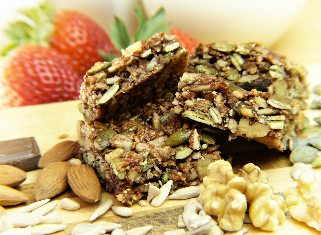 granola boar surrounded by ingredients.