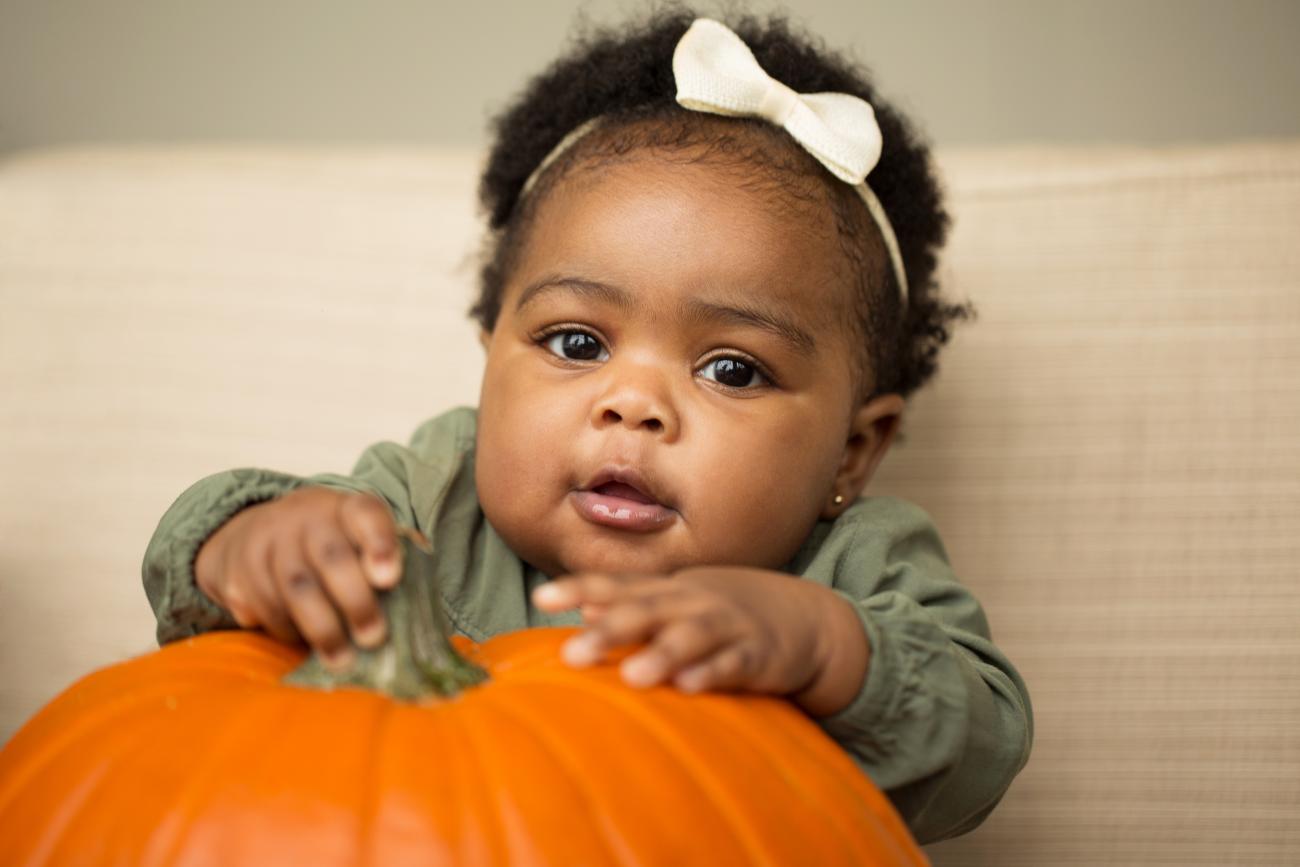 Child with pumpkin