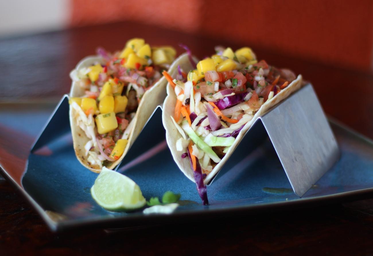 A picture of tacos on a plate.